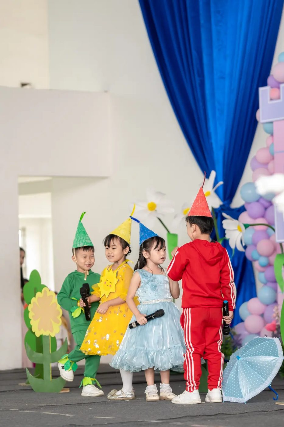 Kindergarten students performing on stage