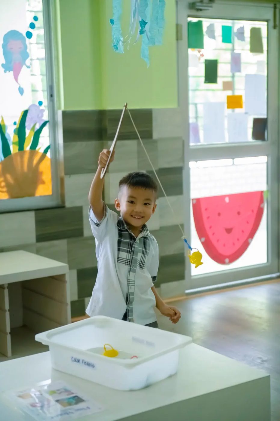 A young Grace Academy student learning through a hands-on activity